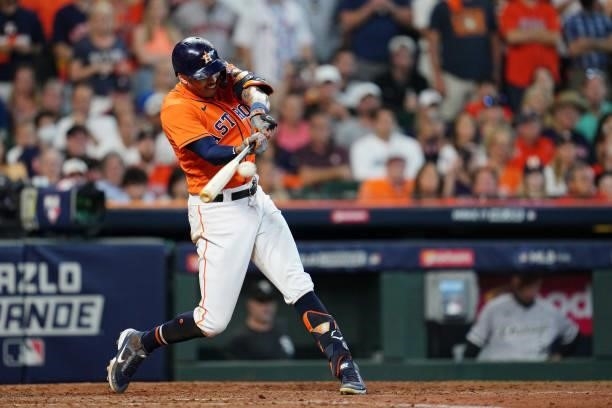 Carlos Correa of the Houston Astros hits a two-run RBI single in the seventh inning during Game 2 of the ALDS between the Chicago White Sox and the...