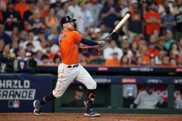 Carlos Correa of the Houston Astros hits a two-run RBI single in the seventh inning during Game 2 of the ALDS between the Chicago White Sox and the...
