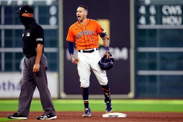 Carlos Correa of the Houston Astros reacts to hitting a two-run RBI single in the seventh inning during Game 2 of the ALDS between the Chicago White...