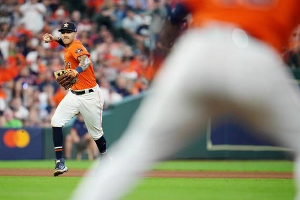 Carlos Correa of the Houston Astros throws to first base for the out during Game 2 of the ALDS between the Chicago White Sox and the Houston Astros...