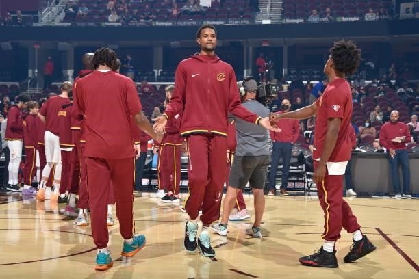 Evan Mobley of the Cleveland Cavaliers high fives before the preseason game against the Indiana Pacers on October 8, 2021 at Rocket Mortgage...