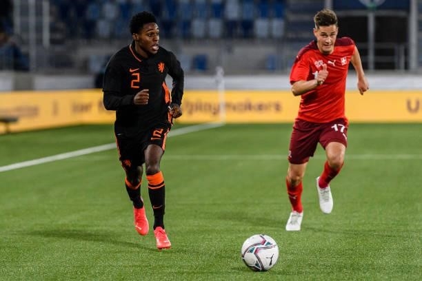 Jeremie Frimpong of Netherlands is chased by Jan Kronig of Switzerland during the UEFA European Under-21 Qualifiers match between Switzerland and...