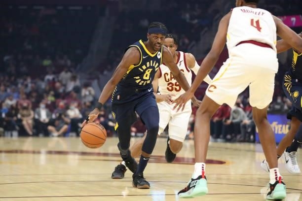 Justin Holiday of the Indiana Pacers drives to the basket during a preseason game against the Cleveland Cavaliers on October 8, 2021 at Rocket...