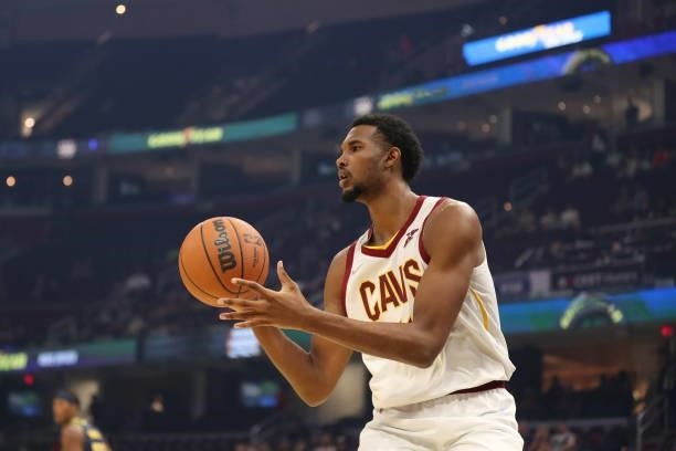 Evan Mobley of the Cleveland Cavaliers passes the ball during a preseason game against the Indiana Pacers on October 8, 2021 at Rocket Mortgage...