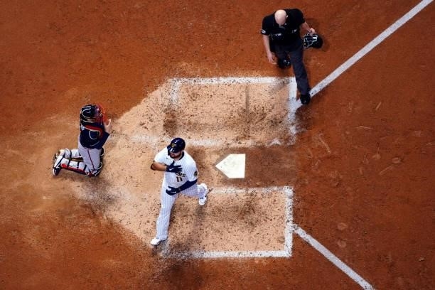 Rowdy Tellez of the Milwaukee Brewers crosses the plate after hitting a two-run home run in the seventh inning of Game 1 of the NLDS between the...