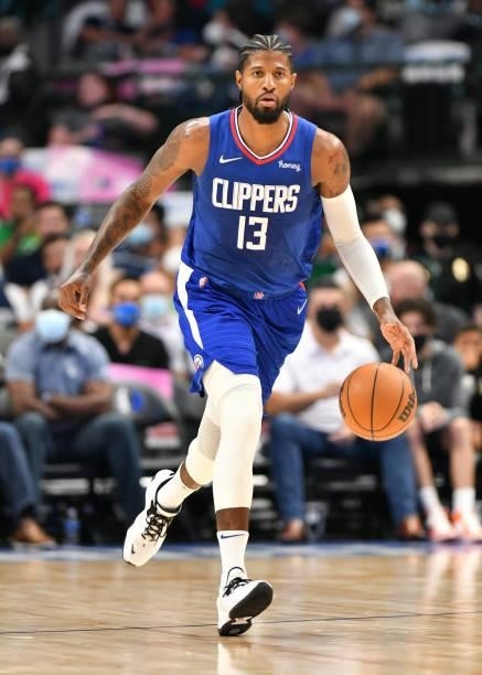 Paul George of the LA Clippers dribbles the ball during a preseason game against the Dallas Mavericks on October 8, 2021 at the American Airlines...