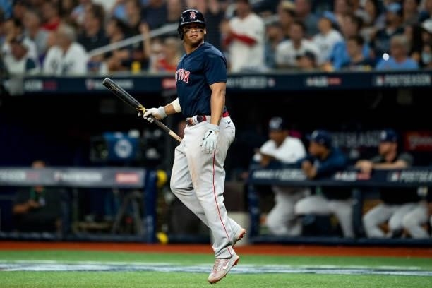 Rafael Devers of the Boston Red Sox reacts after hitting a two run home run during the eighth inning of game two of the 2021 American League Division...