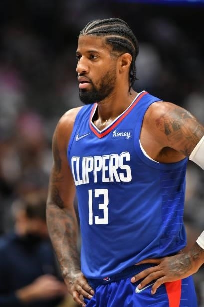 Paul George of the LA Clippers looks on during a preseason game against the Dallas Mavericks on October 8, 2021 at the American Airlines Center in...