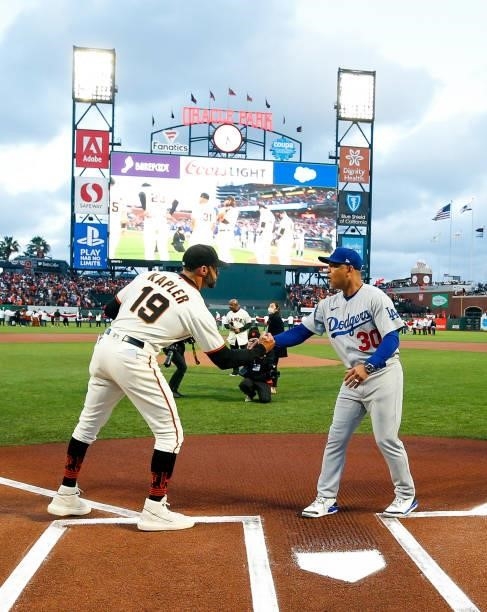 Gabe Kapler of the San Francisco Giants and Dave Roberts of the Los Angeles Dodgers shake hands prior to Game 1 of the NLDS at Oracle Park on Friday,...