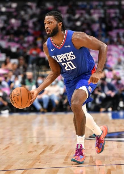 Justise Winslow of the LA Clippers dribbles the ball during a preseason game against the Dallas Mavericks on October 8, 2021 at the American Airlines...