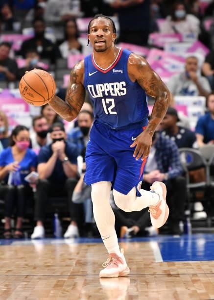 Eric Bledsoe of the LA Clippers dribbles the ball during a preseason game against the Dallas Mavericks on October 8, 2021 at the American Airlines...
