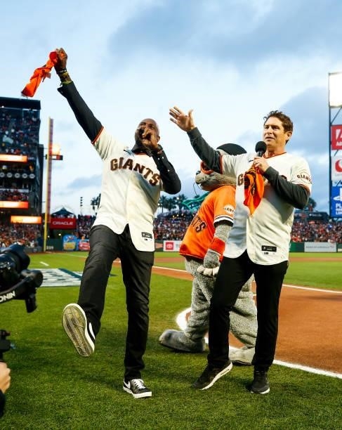 Former professional football players Jerry Rice and Steve Young address the crowd prior to Game 1 of the NLDS between the Los Angeles Dodgers and the...
