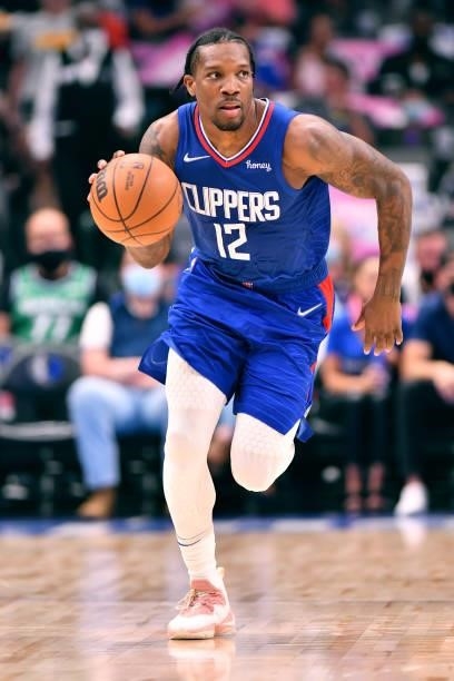 Eric Bledsoe of the LA Clippers dribbles the ball during a preseason game against the Dallas Mavericks on October 8, 2021 at the American Airlines...