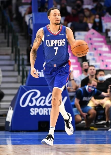 Amir Coffey of the LA Clippers dribbles the ball during a preseason game against the Dallas Mavericks on October 8, 2021 at the American Airlines...