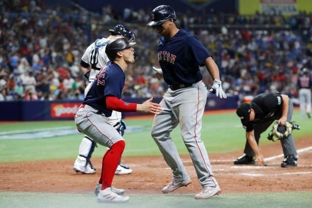 Enrique Hernández and Rafael Devers of the Boston Red Sox celebrate in the eighth inning after Devers hit a two-run home run during Game 2 of the...