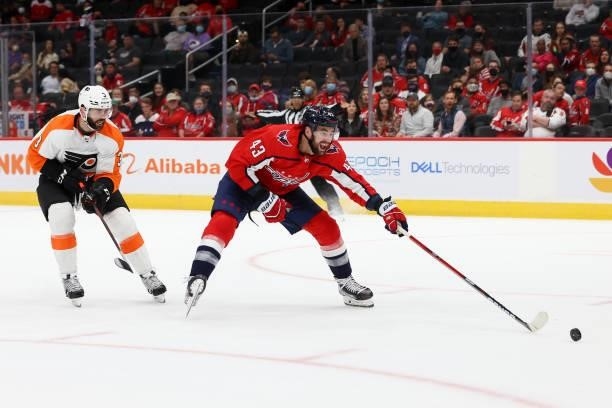 Washington Capitals right wing Tom Wilson chases down a loose puck during a game between the Philadelphia Flyers at Capital One Arena on October 8,...