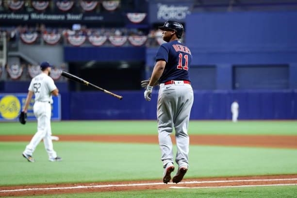 Rafael Devers of the Boston Red Sox flips his bat after hitting a two-run home run in the eighth inning during Game 2 of the ALDS between the Boston...