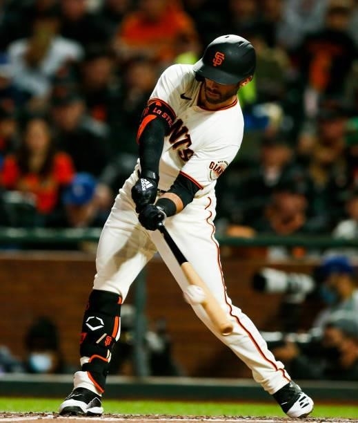 Tommy La Stella of the San Francisco Giants hits a single in the third inning of Game 1 of the NLDS between the Los Angeles Dodgers and the San...