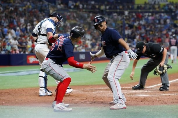 Enrique Hernández and Rafael Devers of the Boston Red Sox celebrate in the eighth inning after Devers hit a two-run home run during Game 2 of the...