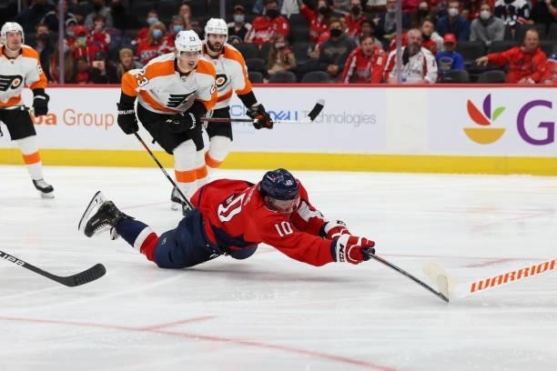 Washington Capitals right wing Daniel Sprong dives to make a play on the puck during a game between the Philadelphia Flyers at Capital One Arena on...