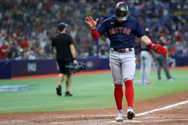 Enrique Hernández of the Boston Red Sox crosses home plate to score on a two-run home run by Rafael Devers in the eighth inning during Game 2 of the...