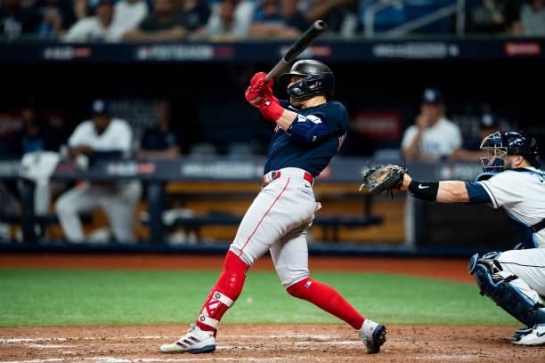 Enrique Herandnez of the Boston Red Sox hits an Rbi single during the ninth inning of game two of the 2021 American League Division Series against...