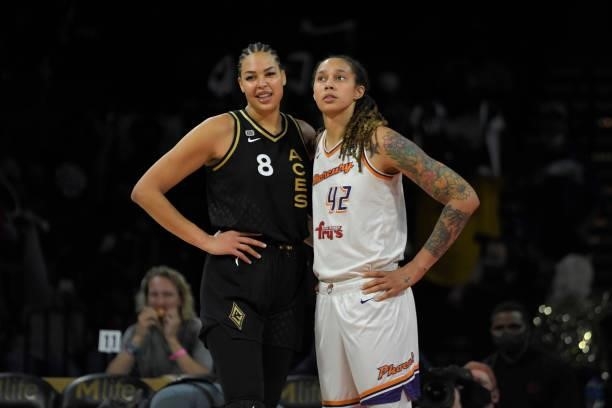 Liz Cambage of the Las Vegas Aces and Brittney Griner of the Phoenix Mercury embrace during Game Five of the 2021 WNBA Semifinals on October 8, 2021...