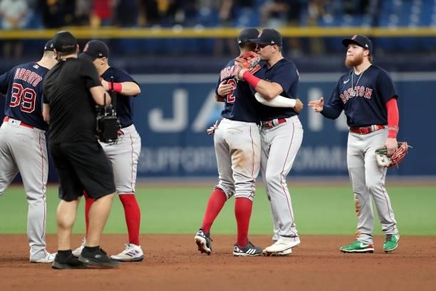 Xander Bogaerts, Hunter Renfroe and Alex Verdugo of the Boston Red Sox celebrate after a 14-6 win in Game 2 of the ALDS between the Boston Red Sox...