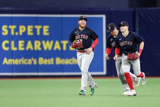 Alex Verdugo, Hunter Renfroe and Enrique Hernández of the Boston Red Sox celebrate after a 14-6 win in Game 2 of the ALDS between the Boston Red Sox...