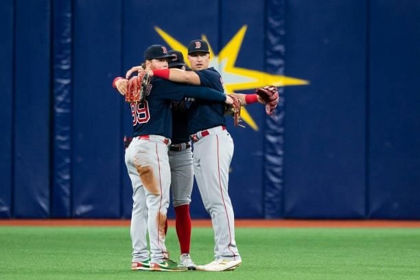 Alex Verdugo, Enrique Hernandez, and Hunter Renfroe of the Boston Red Sox celebrate a victory in game two of the 2021 American League Division Series...