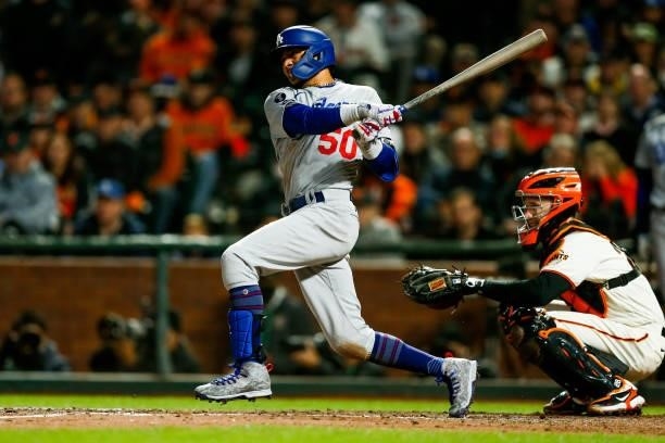 Mookie Betts of the Los Angeles Dodgers hits a single during Game 1 of the NLDS between the Los Angeles Dodgers and the San Francisco Giants at...