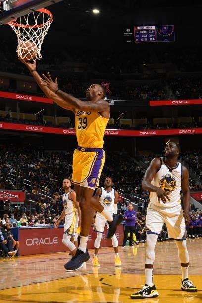 Dwight Howard of the Los Angeles Lakers drives to the basket during a preseason game against the Golden State Warriors on October 8, 2021 at Chase...