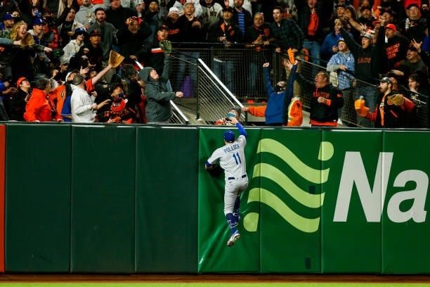 Pollock of the Los Angeles Dodgers watches the home run of Kris Bryant of the San Francisco Giants go over the wall during Game 1 of the NLDS at...
