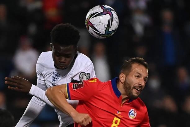 England's midfielder Bukayo Saka vies with Andorra's midfielder Xavier Vieira during the World Cup 2022 qualifier football match between Andorra and...