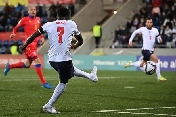England's midfielder Bukayo Saka scores a goal during the World Cup 2022 qualifier football match between Andorra and England at Estadi Nacional...