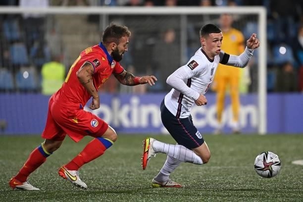 England's midfielder Phil Foden vies with Andorra's midfielder Jordi Rubio during the World Cup 2022 qualifier football match between Andorra and...