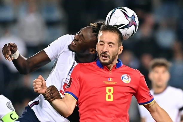 England's forward Tammy Abraham vies with Andorra's midfielder Xavier Vieira during the World Cup 2022 qualifier football match between Andorra and...