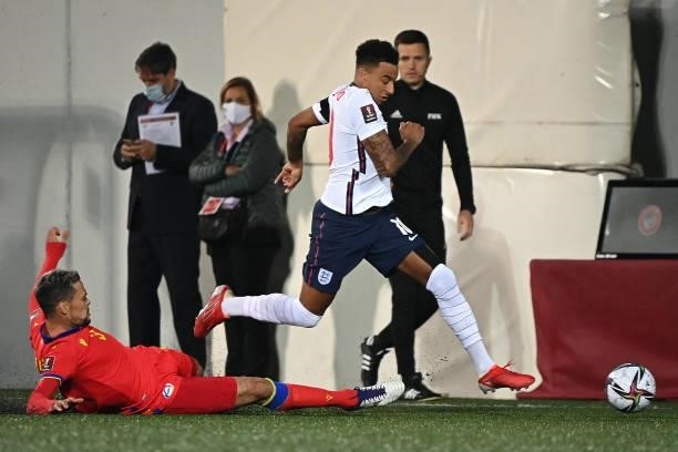 England's midfielder Jesse Lingard vies with Andorra's midfielder Marc Vales during the World Cup 2022 qualifier football match between Andorra and...