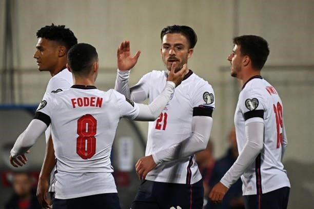 England's midfielder Jack Grealish celebrates with teammates after scoring a goalduring the World Cup 2022 qualifier football match between Andorra...