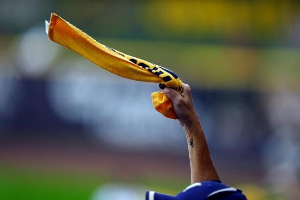 Fan is seen waving a rally towel during Game 2 of the NLDS between the Atlanta Braves and the Milwaukee Brewers at American Family Field on Saturday,...