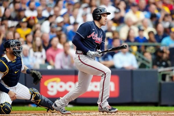 Freddie Freeman of the Atlanta Braves hits a RBI single in the third inning during Game 2 of the NLDS between the Atlanta Braves and the Milwaukee...