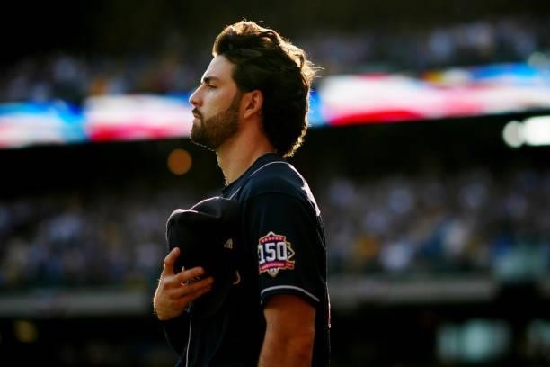 Dansby Swanson of the Atlanta Braves looks on during the singing of the national anthem prior to Game 2 of the NLDS between the Atlanta Braves and...
