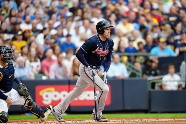 Freddie Freeman of the Atlanta Braves hits a RBI single in the third inning during Game 2 of the NLDS between the Atlanta Braves and the Milwaukee...