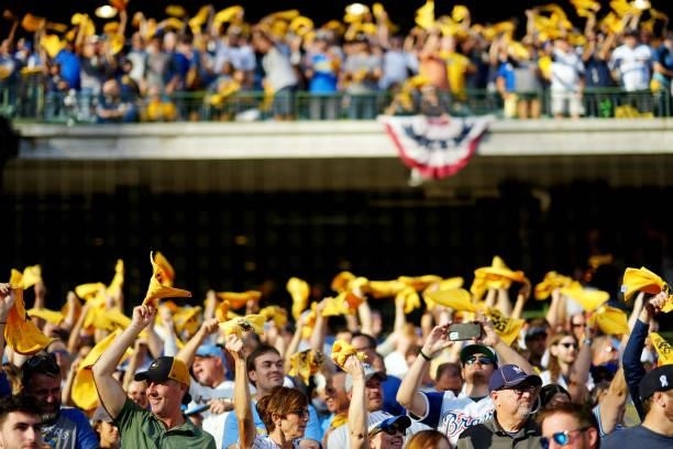 Fans are seen waving rally towels prior to Game 2 of the NLDS between the Atlanta Braves and the Milwaukee Brewers at American Family Field on...