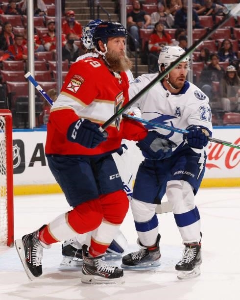 Joe Thornton of the Florida Panthers and Ryan McDonagh of the Tampa Bay Lightning battle for position in front of the net during a preseason game at...