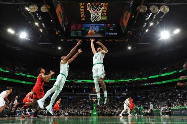 Jayson Tatum of the Boston Celtics catches the rebound during a preseason game against the Toronto Raptors on October 9, 2021 at the TD Garden in...