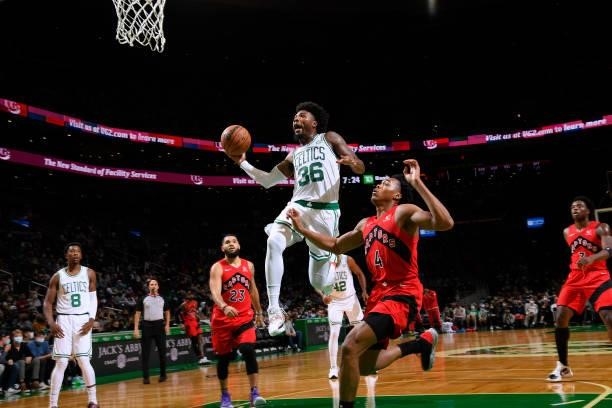 Marcus Smart of the Boston Celtics drives to the basket during a preseason game against the Toronto Raptors on October 9, 2021 at the TD Garden in...