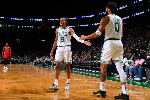 Romeo Langford of the Boston Celtics high fives Jayson Tatum of the Boston Celtics during a preseason game against the Toronto Raptors on October 9,...