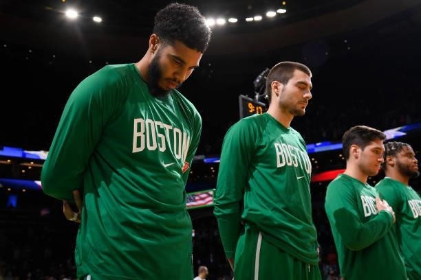 Jayson Tatum of the Boston Celtics stands for the National Anthem prior to a preseason game against the Toronto Raptors on October 9, 2021 at the TD...