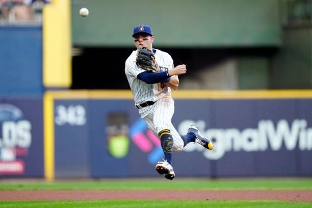 Willy Adames of the Milwaukee Brewers throws to first for the out during Game 2 of the NLDS between the Atlanta Braves and the Milwaukee Brewers at...